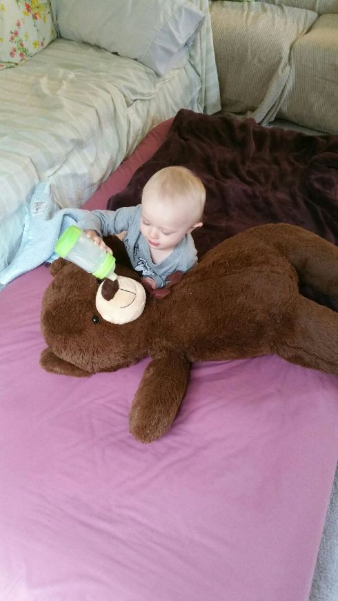 Babysitter pic - Feeding his Pillow Bear - May 4, 2016